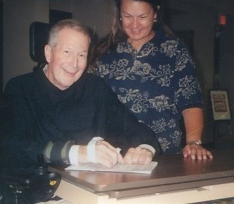 Andy & Sandy signing papers for Refuge Farms