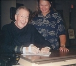 Andy & Sandy signing papers for Refuge Farms